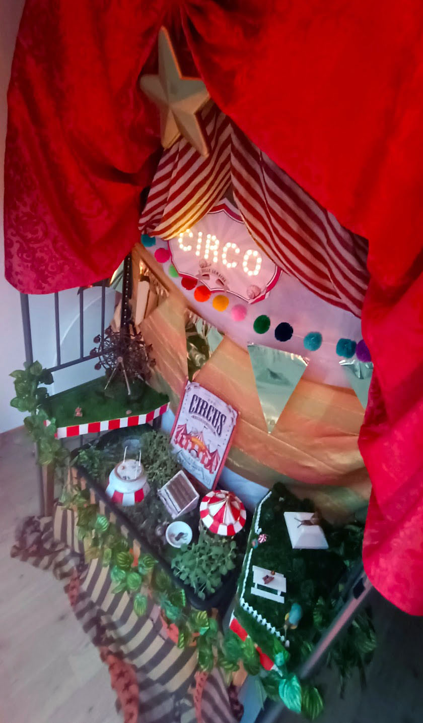 Overhead view of the miniature circus tent, red big-top roof seen from above